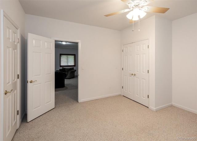 1660 Old Antlers Way, Monument, CO 80132 - unfurnished bedroom with light colored carpet, a ceiling fan, and a closet