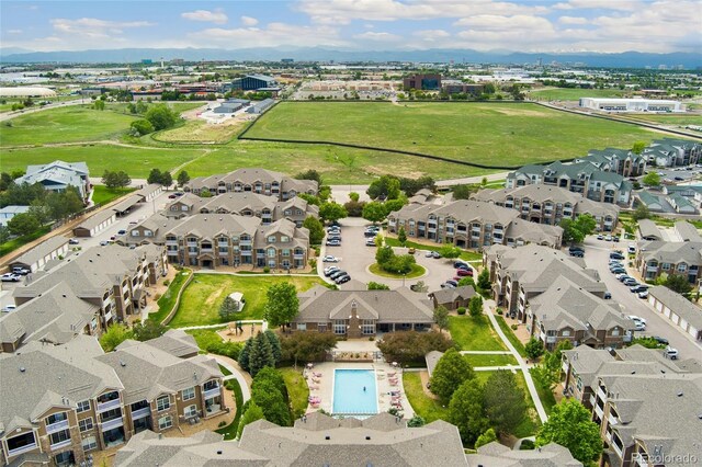 7440 S Blackhawk St Unit 7-303, Englewood, CO 80112 - aerial view of property and surrounding area featuring nearby suburban area and a pool