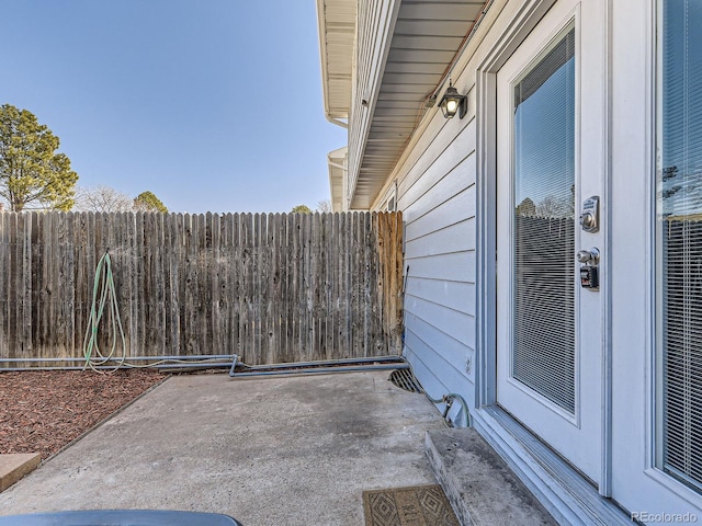 view of patio / terrace featuring fence