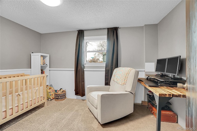 carpeted bedroom featuring a textured ceiling