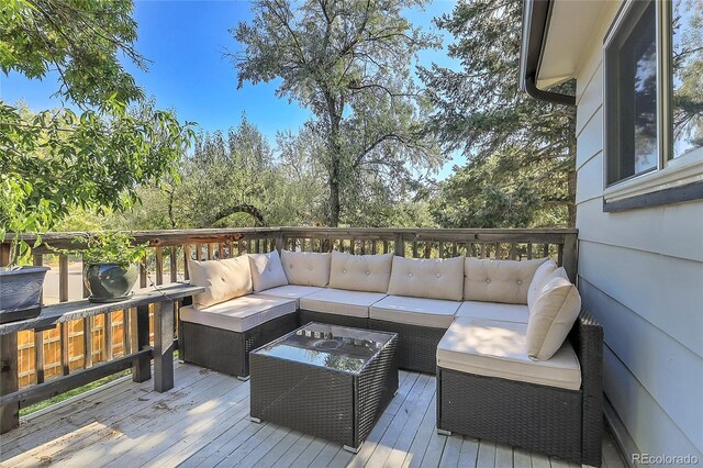 wooden terrace featuring outdoor lounge area