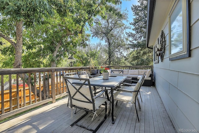 deck with outdoor dining area and outdoor lounge area