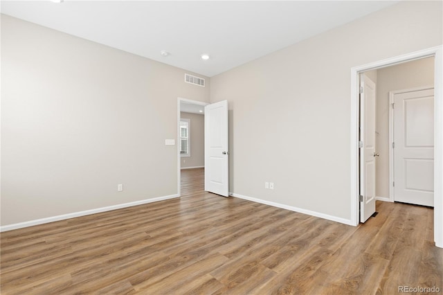 27639 E 7th Ln, Aurora, CO 80018 - spare room featuring light wood finished floors, recessed lighting, and baseboards