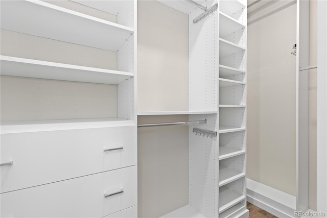 27639 E 7th Ln, Aurora, CO 80018 - spacious closet featuring wood finished floors