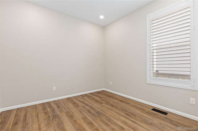 27639 E 7th Ln, Aurora, CO 80018 - spare room with baseboards, wood finished floors, and recessed lighting