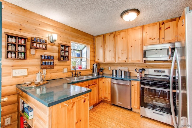 1275 Niagara St, Denver, CO 80220 - kitchen featuring appliances with stainless steel finishes, a sink, dark countertops, a textured ceiling, and light brown cabinets