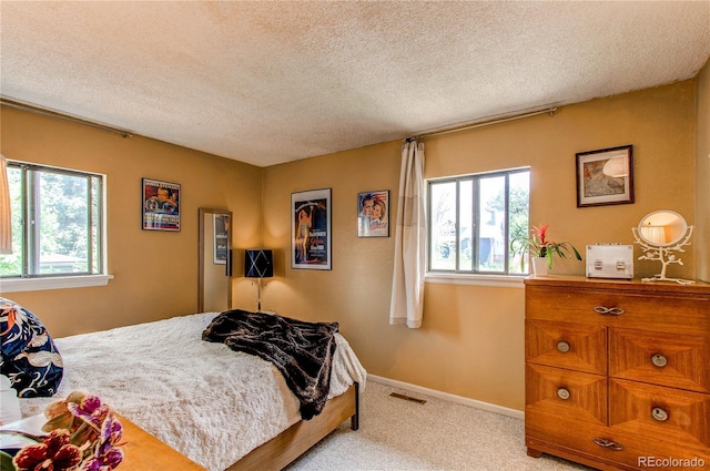 1275 Niagara St, Denver, CO 80220 - bedroom featuring light colored carpet, a textured ceiling, and baseboards