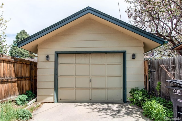 1275 Niagara St, Denver, CO 80220 - detached garage featuring concrete driveway