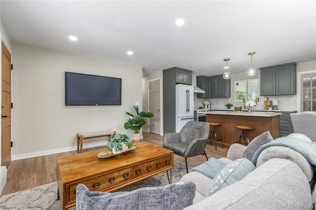 1120 Hartford Dr, Boulder, CO 80305 - living area featuring light wood-type flooring and recessed lighting