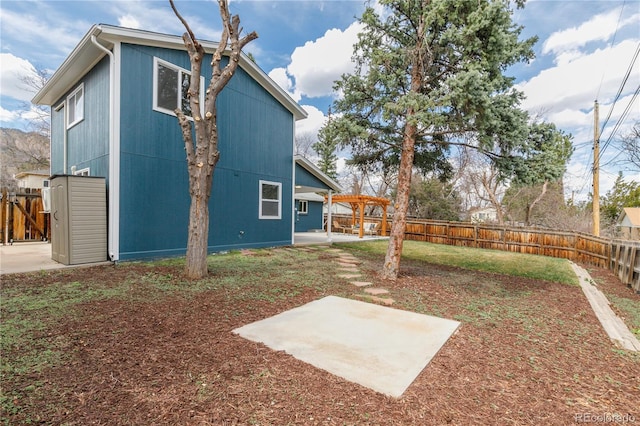 1120 Hartford Dr, Boulder, CO 80305 - back of property with a patio area and a fenced backyard