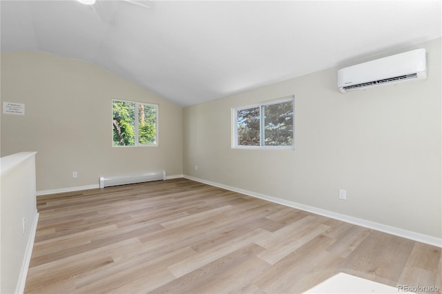 1120 Hartford Dr, Boulder, CO 80305 - empty room featuring a wall unit AC, a baseboard radiator, vaulted ceiling, light wood-type flooring, and a ceiling fan