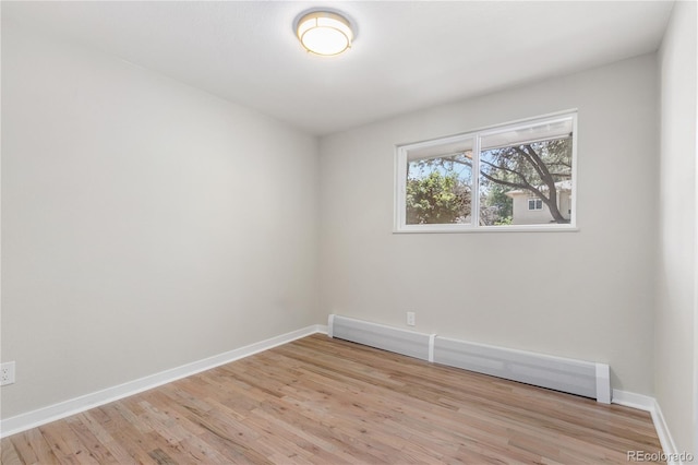 1120 Hartford Dr, Boulder, CO 80305 - spare room with baseboard heating and light wood-style flooring