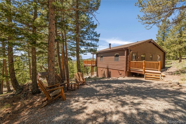 73 Elk Way, Drake, CO 80515 - view of side of home with log siding and a deck