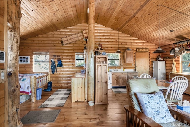 73 Elk Way, Drake, CO 80515 - dining space featuring vaulted ceiling, healthy amount of natural light, wood-type flooring, wood ceiling, and log walls