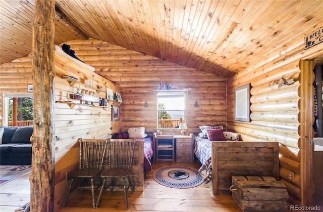 73 Elk Way, Drake, CO 80515 - bedroom featuring vaulted ceiling, hardwood / wood-style floors, rustic walls, and wood ceiling