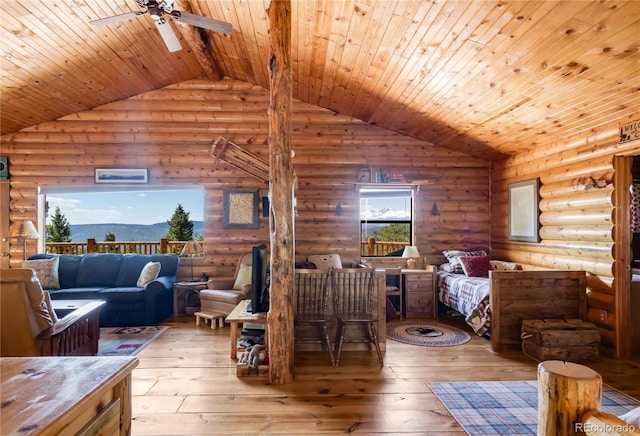 73 Elk Way, Drake, CO 80515 - bedroom with rustic walls, vaulted ceiling, light wood-style flooring, and wood ceiling