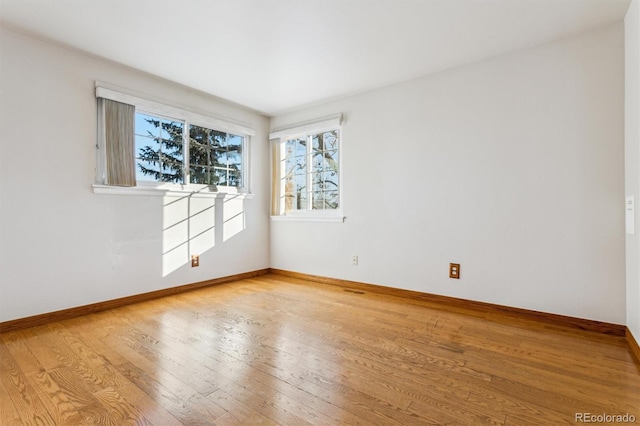 spare room featuring hardwood / wood-style floors