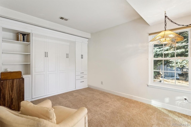 living area with carpet and a healthy amount of sunlight