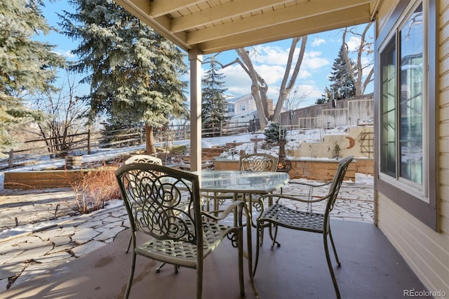 view of snow covered patio