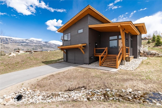 17 Vendette Rd, Silverthorne, CO 80498 - back of house with a mountain view, a garage, and driveway