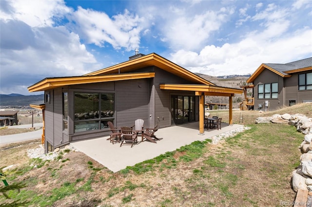 17 Vendette Rd, Silverthorne, CO 80498 - back of property with a patio and a mountain view