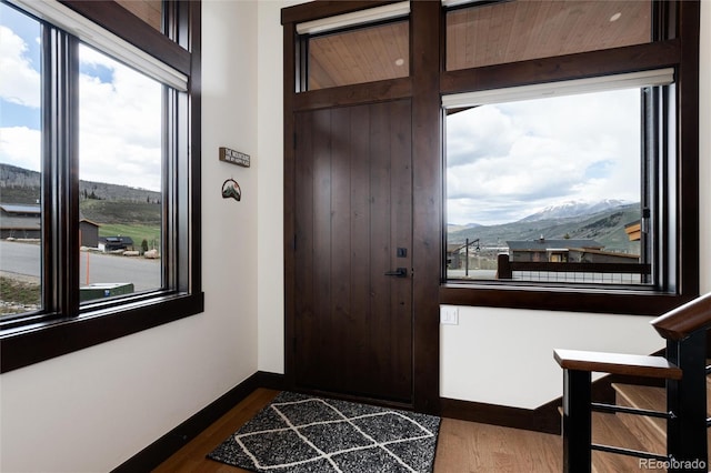 17 Vendette Rd, Silverthorne, CO 80498 - entrance foyer with a mountain view, dark wood-type flooring, and baseboards