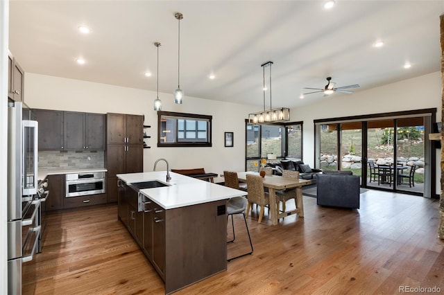 17 Vendette Rd, Silverthorne, CO 80498 - kitchen with a sink, stainless steel appliances, light countertops, ceiling fan, and dark brown cabinetry