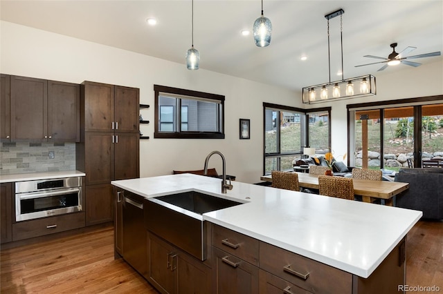 17 Vendette Rd, Silverthorne, CO 80498 - kitchen featuring appliances with stainless steel finishes, open floor plan, a sink, light countertops, and plenty of natural light