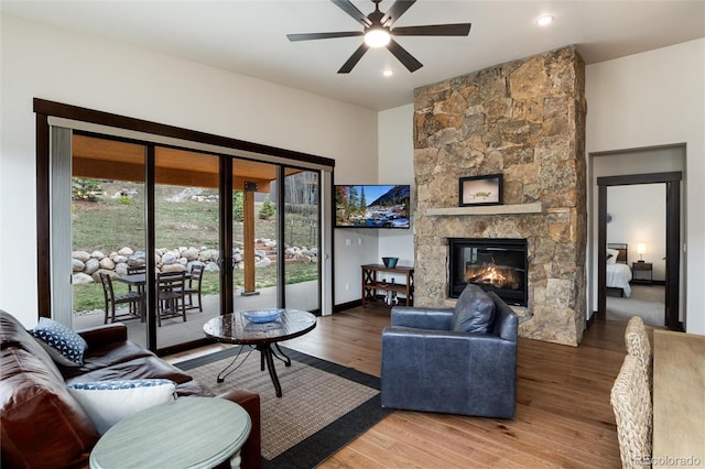 17 Vendette Rd, Silverthorne, CO 80498 - living area with ceiling fan, wood finished floors, and a stone fireplace