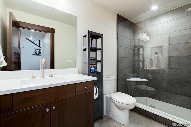 17 Vendette Rd, Silverthorne, CO 80498 - bathroom featuring toilet, a shower stall, vanity, and tile patterned flooring