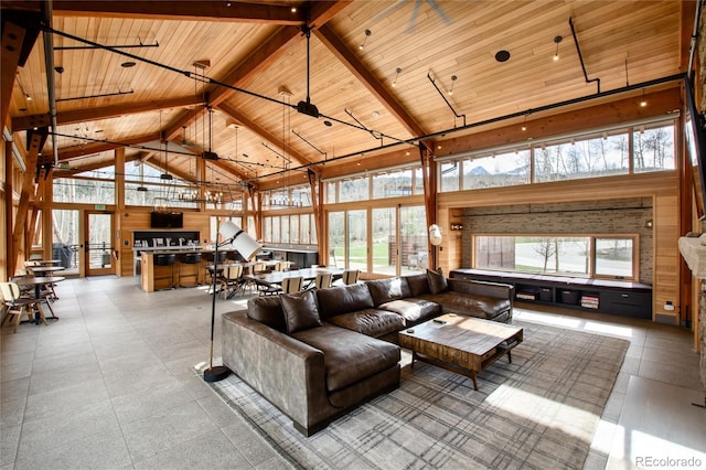 17 Vendette Rd, Silverthorne, CO 80498 - living room with high vaulted ceiling, wood ceiling with exposed beams, plenty of natural light, and wooden walls