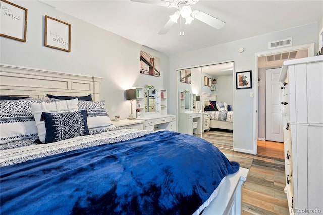 3663 S Sheridan Blvd Unit O15, Denver, CO 80235 - bedroom featuring light wood-style flooring and ceiling fan