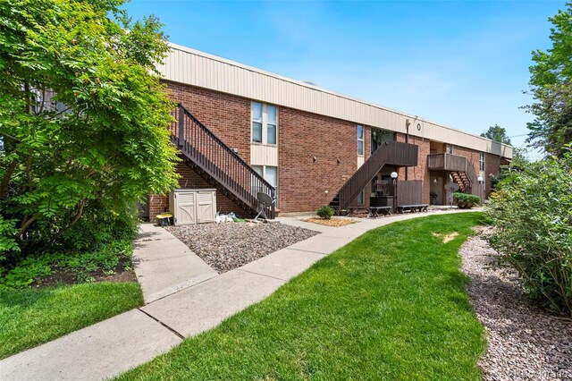 3663 S Sheridan Blvd Unit O15, Denver, CO 80235 - view of building exterior with stairs