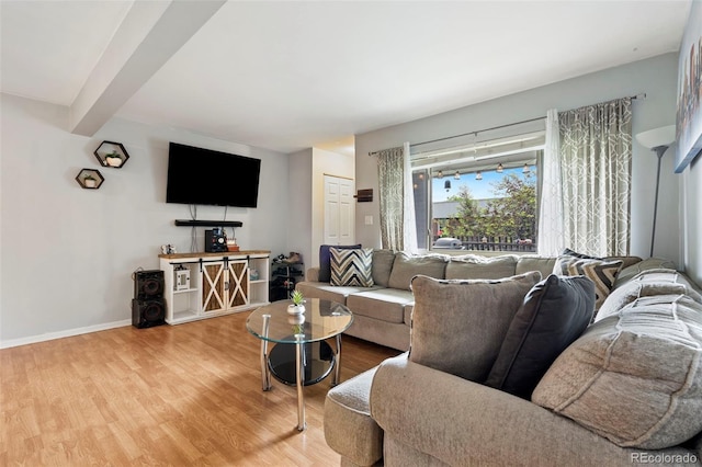 3663 S Sheridan Blvd Unit O15, Denver, CO 80235 - living area featuring wood finished floors and beam ceiling
