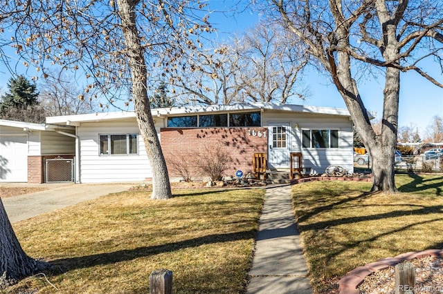 ranch-style house with a carport and a front yard