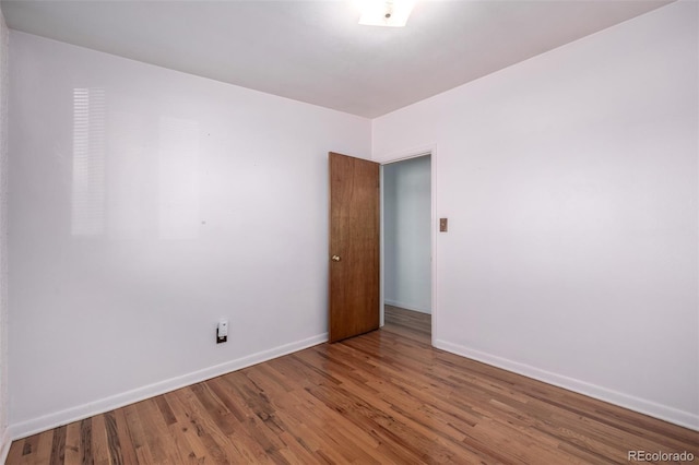 empty room featuring hardwood / wood-style floors