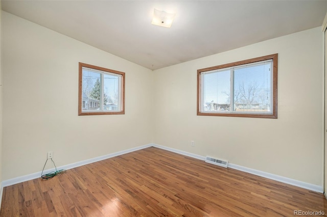 empty room featuring wood-type flooring