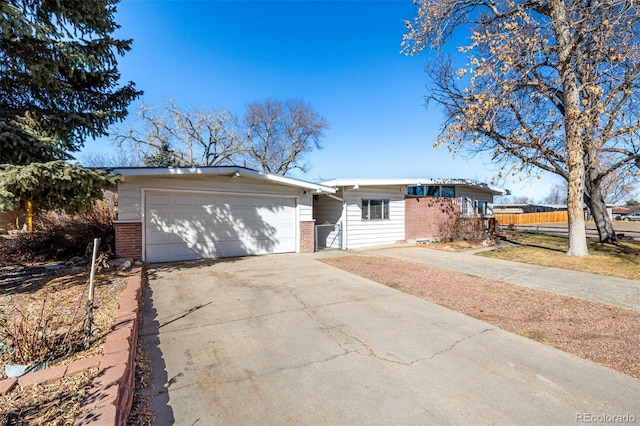 ranch-style home featuring a garage