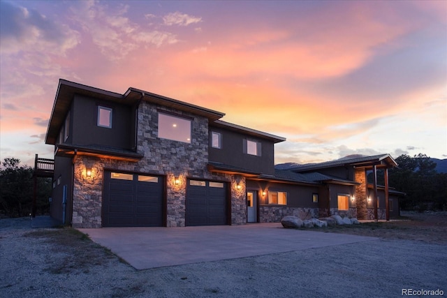 17158 County Road 363, Buena Vista, CO 81211 - contemporary house with stone siding, driveway, and a garage