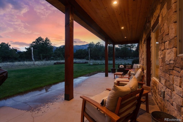 17158 County Road 363, Buena Vista, CO 81211 - patio terrace at dusk with a lawn and a patio area