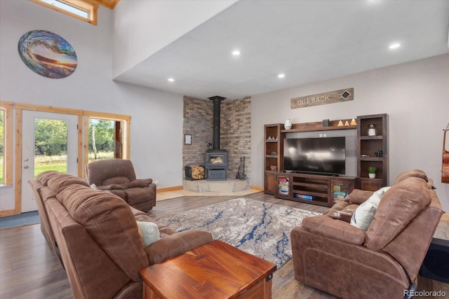 17158 County Road 363, Buena Vista, CO 81211 - living room with a wood stove, wood finished floors, recessed lighting, and a high ceiling