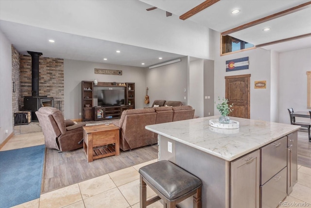 17158 County Road 363, Buena Vista, CO 81211 - kitchen featuring a center island, light tile patterned floors, light stone countertops, open floor plan, and recessed lighting