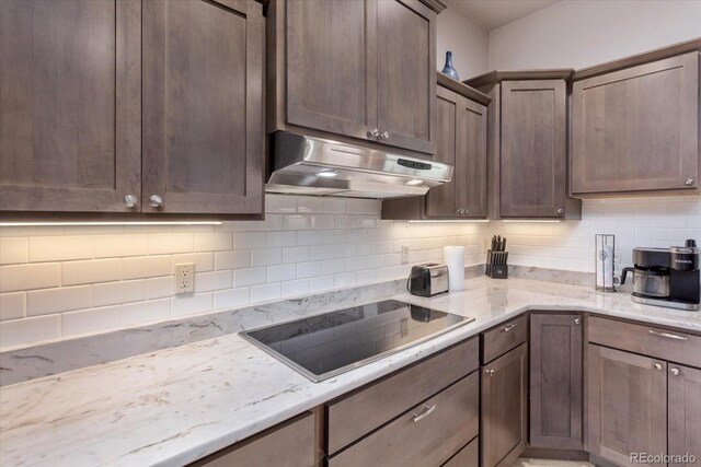 17158 County Road 363, Buena Vista, CO 81211 - kitchen featuring under cabinet range hood, black electric stovetop, tasteful backsplash, and dark brown cabinets