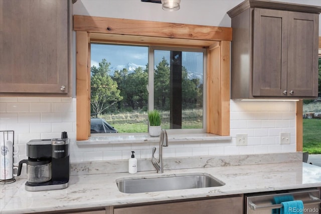17158 County Road 363, Buena Vista, CO 81211 - kitchen with a sink, dishwasher, backsplash, and light stone counters