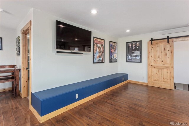 17158 County Road 363, Buena Vista, CO 81211 - interior space with a barn door, wood finished floors, recessed lighting, and baseboards
