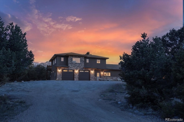 17158 County Road 363, Buena Vista, CO 81211 - view of front of property featuring stone siding, an attached garage, and driveway
