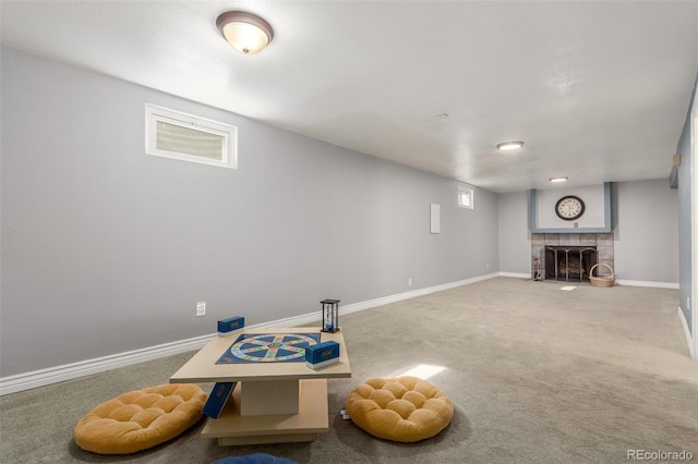 interior space with carpet flooring, baseboards, and a fireplace