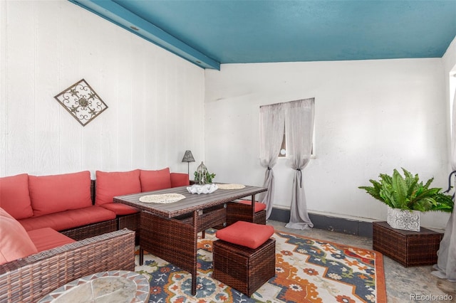 living room featuring lofted ceiling