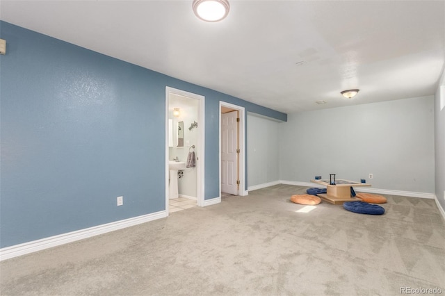 interior space with carpet flooring and baseboards