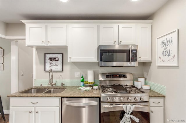 3541 E 118th Ave, Thornton, CO 80233 - kitchen with appliances with stainless steel finishes, a sink, and white cabinetry